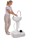 Hands-free foot pump portable camping sink with a large basin, soap dispenser, and towel rack for convenient outdoor washing.
