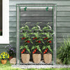 Portable mini greenhouse with a roll-up zippered door, showcasing plants in pots for convenient access and healthy.