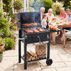 Portable outdoor barbecue grill in black with adjustable charcoal tray and wheels, perfect for outdoor cooking.