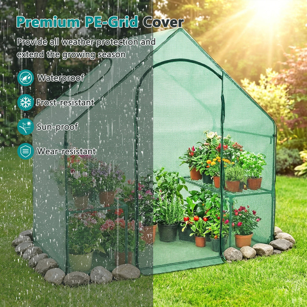 Portable outdoor warm house with PE cover, zippered door, and sturdy design for year-round plant protection.