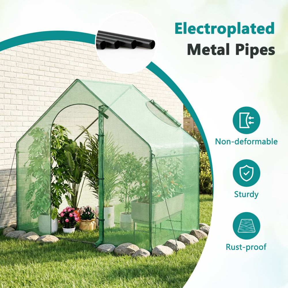 Portable outdoor warm house with PE cover, zippered door, and sturdy electroplated metal pipes for year-round plant protection.