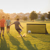 Portable pop-up toddler soccer net with metal frame, ideal for outdoor training and group games on grass.