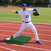 Pitcher demonstrating a throw from the portable pitching mound with EVA handle, designed for optimal traction and.
