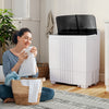 Portable washing machine with built-in drain pump, 12 lbs capacity, ideal for home and RV use, shown in a cozy laundry.