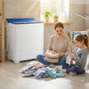 Portable washing machine with blue lid, featuring twin tub design, ideal for daily laundry needs in apartments.