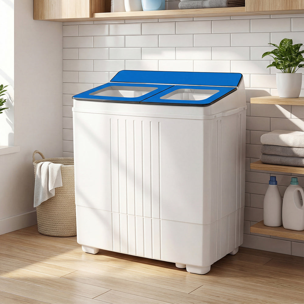 Portable washing machine with blue lid, twin tub design, and see-through acrylic lid for easy laundry monitoring.