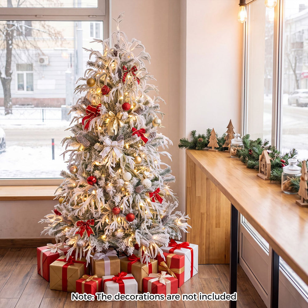 Pre-lit artificial Christmas tree with warm white LED lights, snow flocking, and a stable metal base for festive displays.