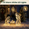 Pre-lit artificial crystal Holy Family decoration glows with 175 warm white LED lights in a nighttime yard display.