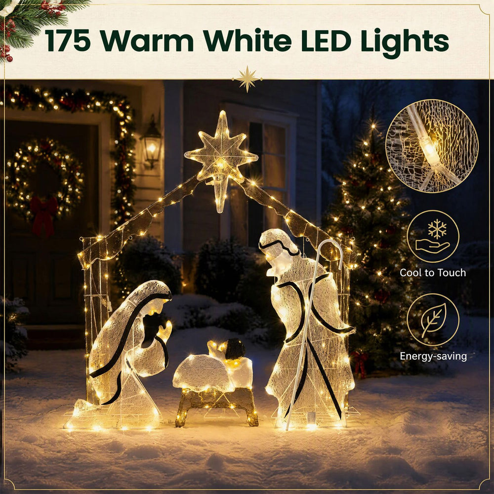 Pre-lit artificial crystal Holy Family decoration glows with 175 warm white LED lights in a nighttime yard display.