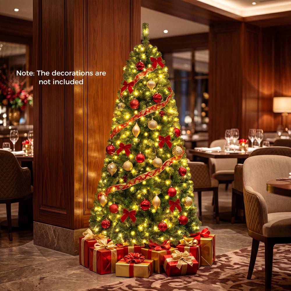 Pre-lit 6-foot green artificial Christmas tree with full branch tips and 600 LED lights for festive ambiance.