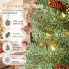 Pre-lit mini Christmas tree with snow-dusted tips and pine cones glows with warm white LED lights for festive small spaces.