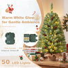 Pre-lit mini Christmas tree with 50 warm white LED lights and pine cones, shown glowing in a festive setting.