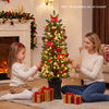 Pre-lit potted pencil Christmas tree with red berries and pine cones, perfect for festive holiday decorating.