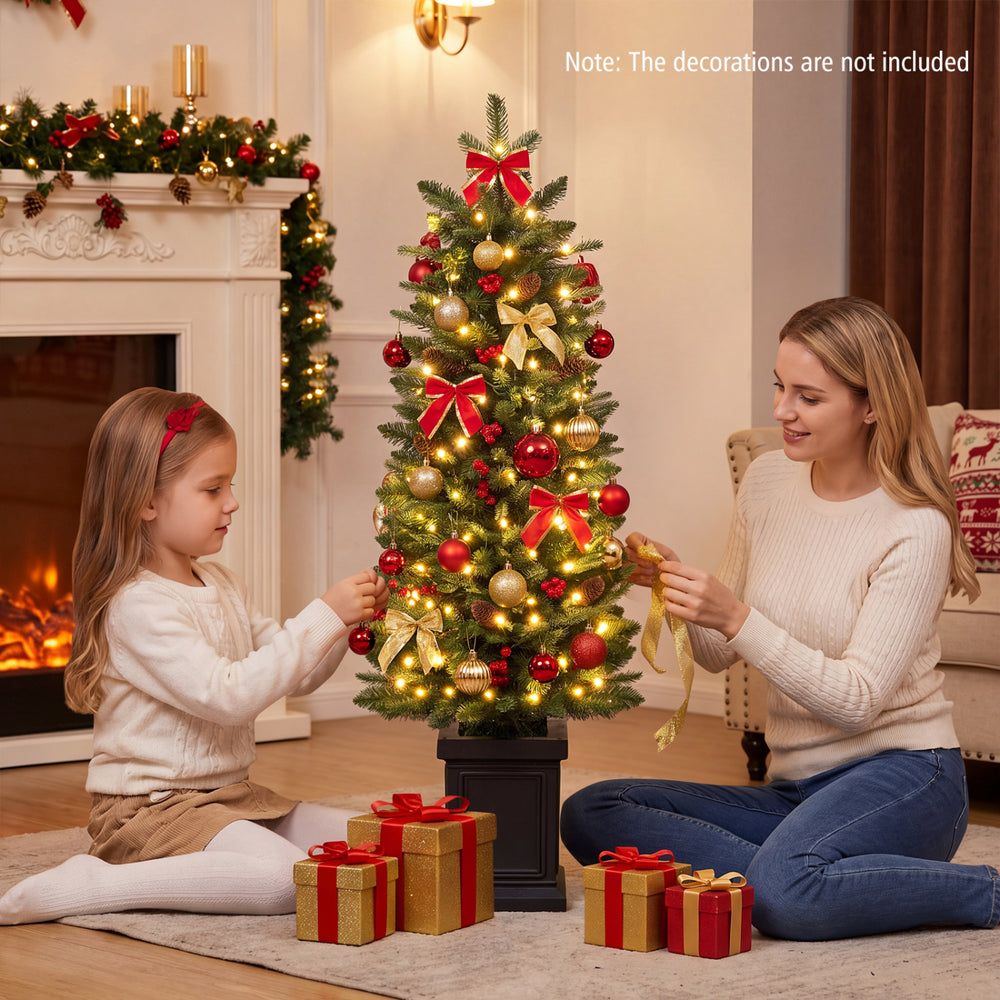 Pre-lit potted pencil Christmas tree with red berries and pine cones, perfect for festive holiday decorating.