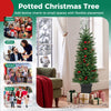 Pre-lit potted pencil Christmas tree with red berries and pine cones, perfect for festive decoration in small spaces.