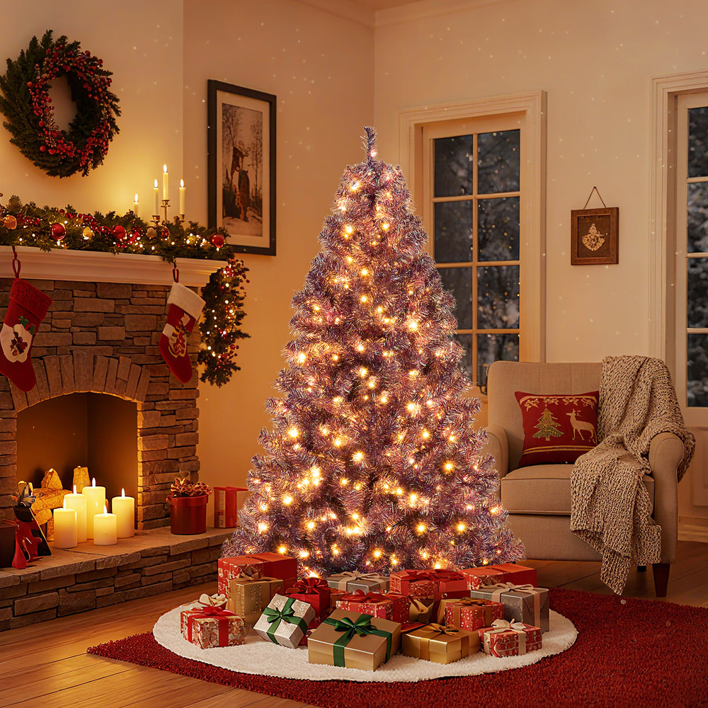 Pre-lit 6ft tinsel Christmas tree in deep purple with warm white LED lights and lush branch tips, perfect for festive.