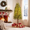 Prelit 6FT artificial Christmas tree with warm white and multicolor LED lights, surrounded by wrapped gifts in a cozy setting.