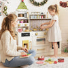 Beige pretend toy kitchen set showing a child cooking with a microwave and stoves, designed for imaginative play.