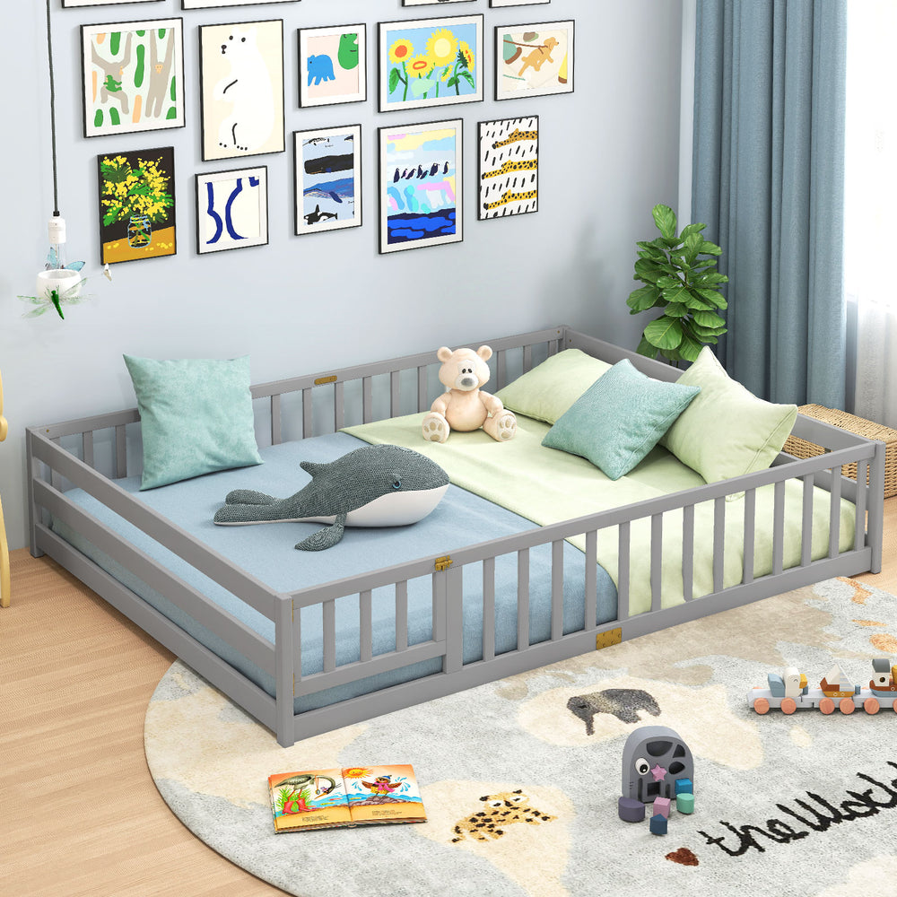 Gray Montessori floor bed with full-length safety guardrails, ideal for kids' sleeping and play activities.