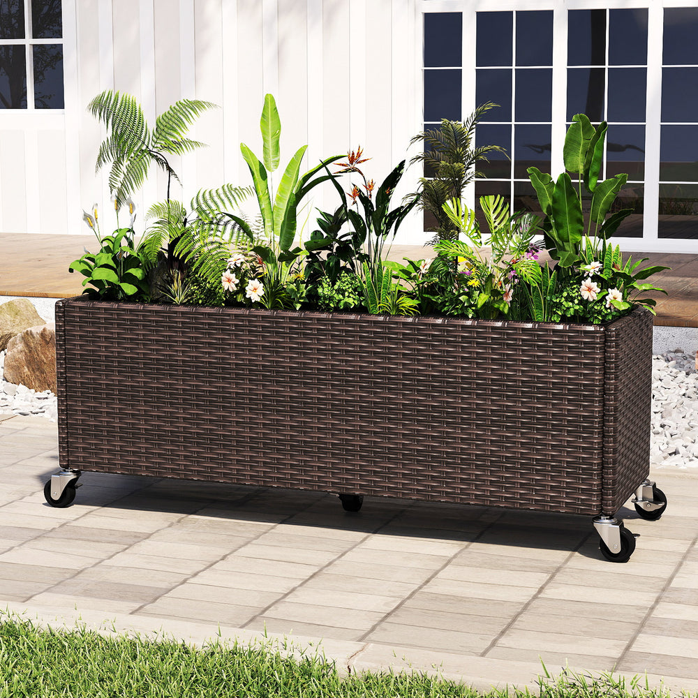 Raised garden bed planter box made of PE rattan with wheels, ideal for outdoor patios and cultivating various plants.