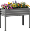 Elevated grey metal raised garden bed with vibrant flowers, ideal for comfortable gardening and healthy plant growth.