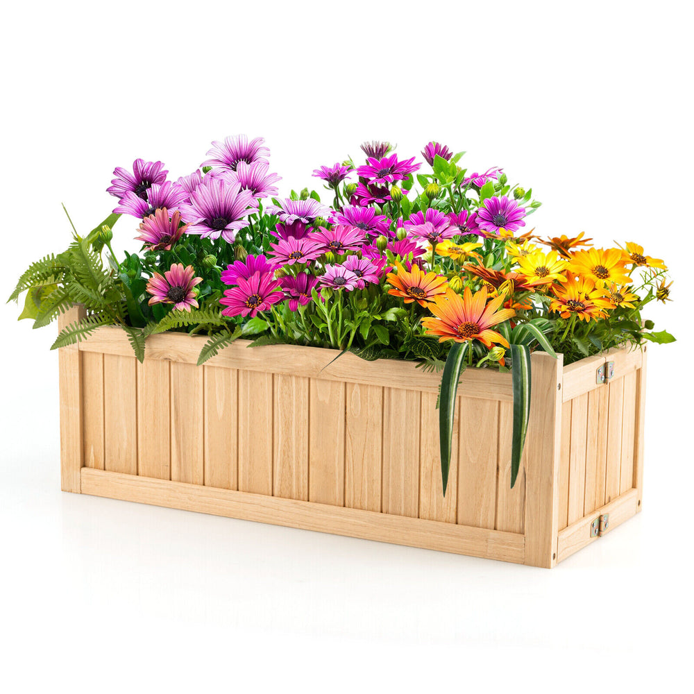 Folding wooden raised garden bed with vibrant flowers, ideal for patio or garden, made from durable fir wood.