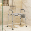 Raised toilet seat with handles and padded arms, adjustable height, ideal for seniors, used as a shower chair.