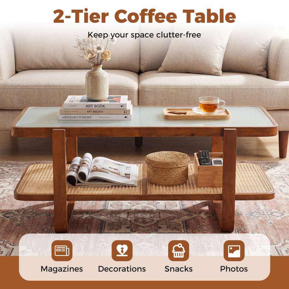 Rattan coffee table with tempered glass top and storage shelf in walnut, perfect for magazines and snacks.