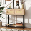 Boho-inspired rattan console table with two drawers and open shelf, perfect for entryway or living room storage.