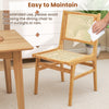 Rattan dining chair with natural cane backrest and teak wood frame, designed for comfort and easy maintenance.