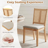 Rattan dining chair with a curved backrest, padded seat, and natural wood finish, ideal for dining rooms and kitchens.