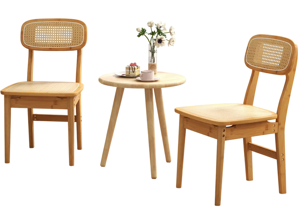 Set of 2 natural rattan dining chairs with ergonomic backrests, perfect for living or dining room use.