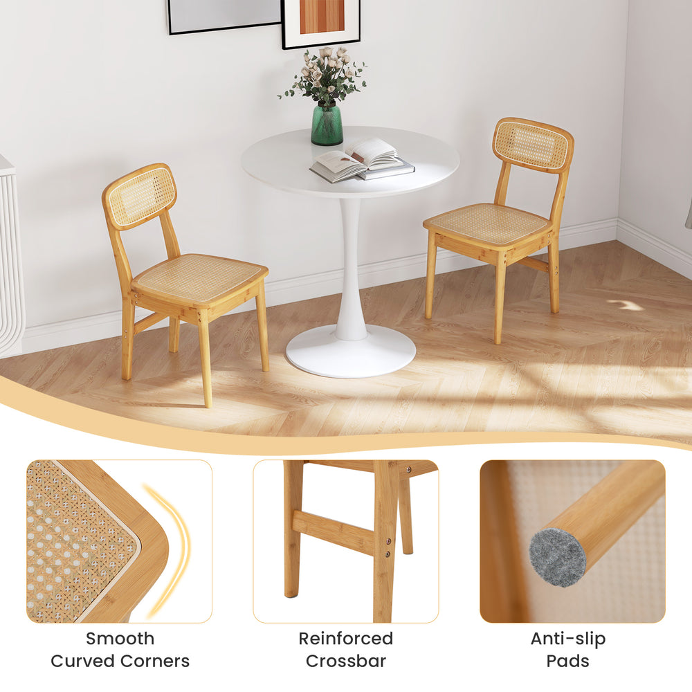 Set of 2 natural rattan dining chairs with ergonomic backrest and smooth curved corners, perfect for dining room use.