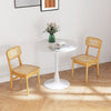Set of 2 natural rattan dining chairs with ergonomic backrest, perfect for dining or living room use.