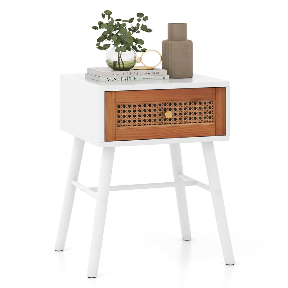 Mid-century modern rattan nightstand with white finish, drawer, and solid wood legs, perfect for bedroom decor.