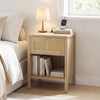 Rattan nightstand in oak with integrated charging station and artificial rattan detailing for a stylish bedside accent.