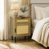 Rattan nightstand with drawer and storage cabinet, featuring a natural finish and metal legs for bedroom organization.