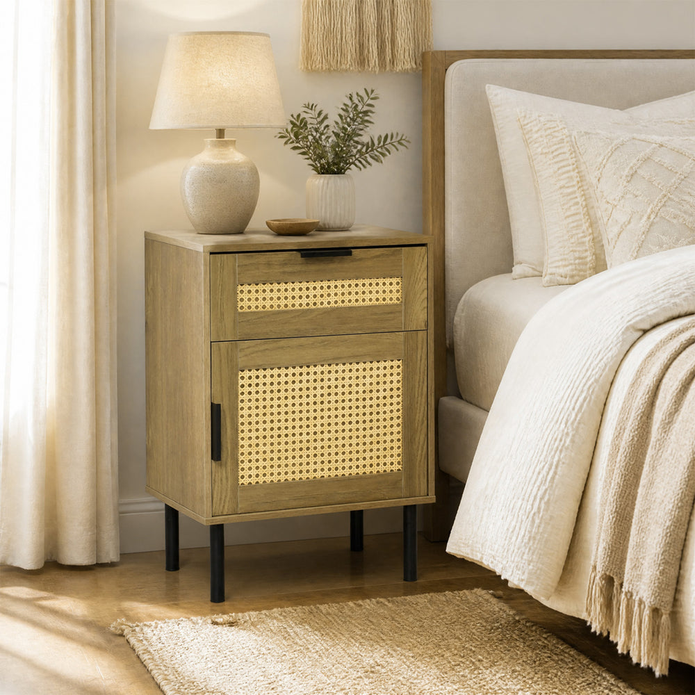Rattan nightstand with drawer and storage cabinet, featuring a natural finish and metal legs for bedroom organization.