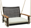 Single rattan porch swing with white cushion, acacia wood armrests, and durable hanging ropes for outdoor relaxation.