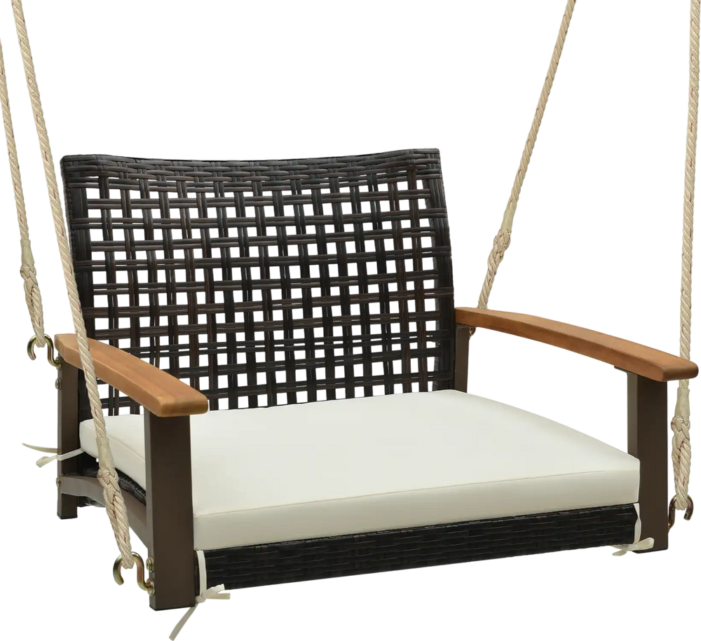 Single rattan porch swing with white cushion, acacia wood armrests, and durable hanging ropes for outdoor relaxation.