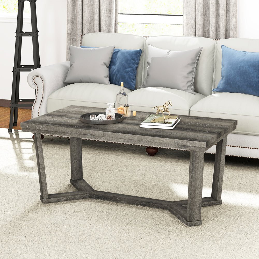 Rectangle coffee table with a gray rubber wood base and cross-shaped design, perfect for living room essentials.