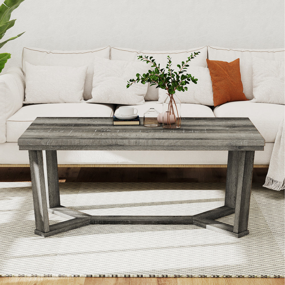 Rectangle coffee table with gray rubber wood base and cross-shaped design, perfect for living room essentials.