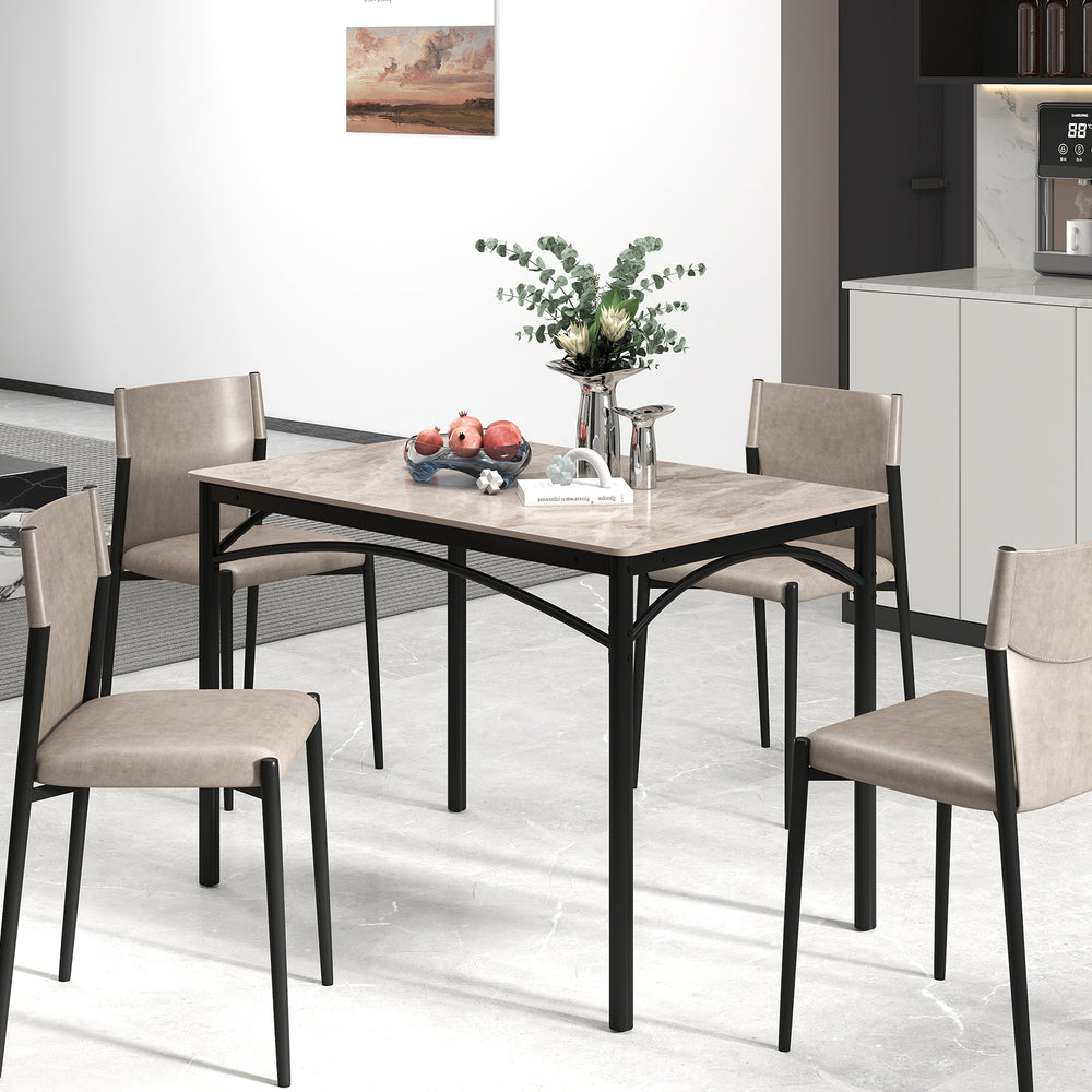 Rectangular modern dining table with grey sintered stone top and sturdy black metal frame, suitable for four people.