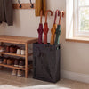 Rectangular black umbrella holder rack with removable drip tray, neatly storing colorful umbrellas in an entryway.