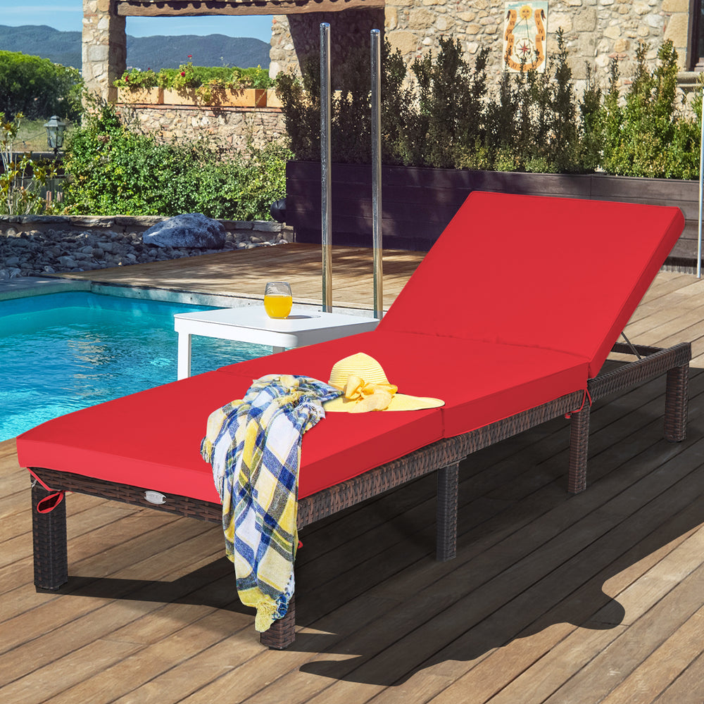 Red outdoor rattan adjustable cushioned chaise lounge by the pool, featuring a sturdy steel frame and removable cushion.