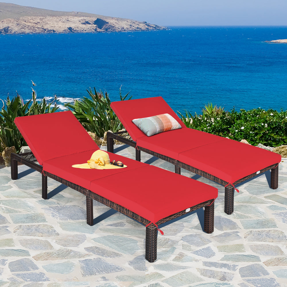 Red cushioned outdoor rattan chaise lounge set with adjustable backrest, perfect for patio and poolside relaxation.