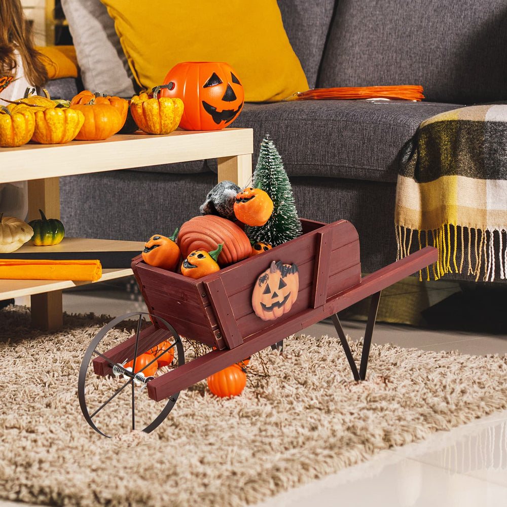 Wooden wagon planter in red with Halloween decorations, perfect for garden or home display. Durable pine wood.
