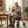 Purple rollator walker with seat, adjustable handles, and storage bag, ideal for indoor use and resting.