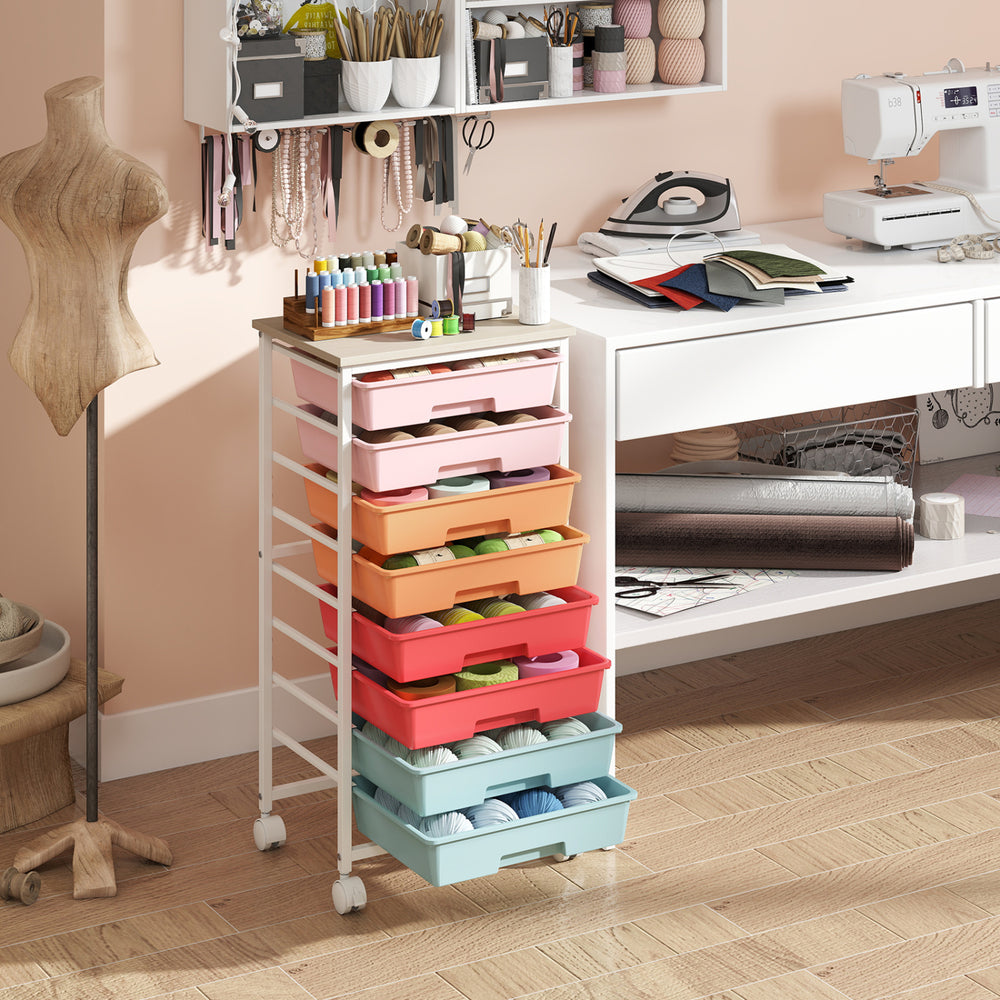 Rolling cart with 8 removable drawers and a wooden tabletop, ideal for organizing crafts and supplies in various spaces.