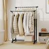 Double rod garment rack with adjustable height, featuring smooth-rolling casters for easy mobility and durable metal.